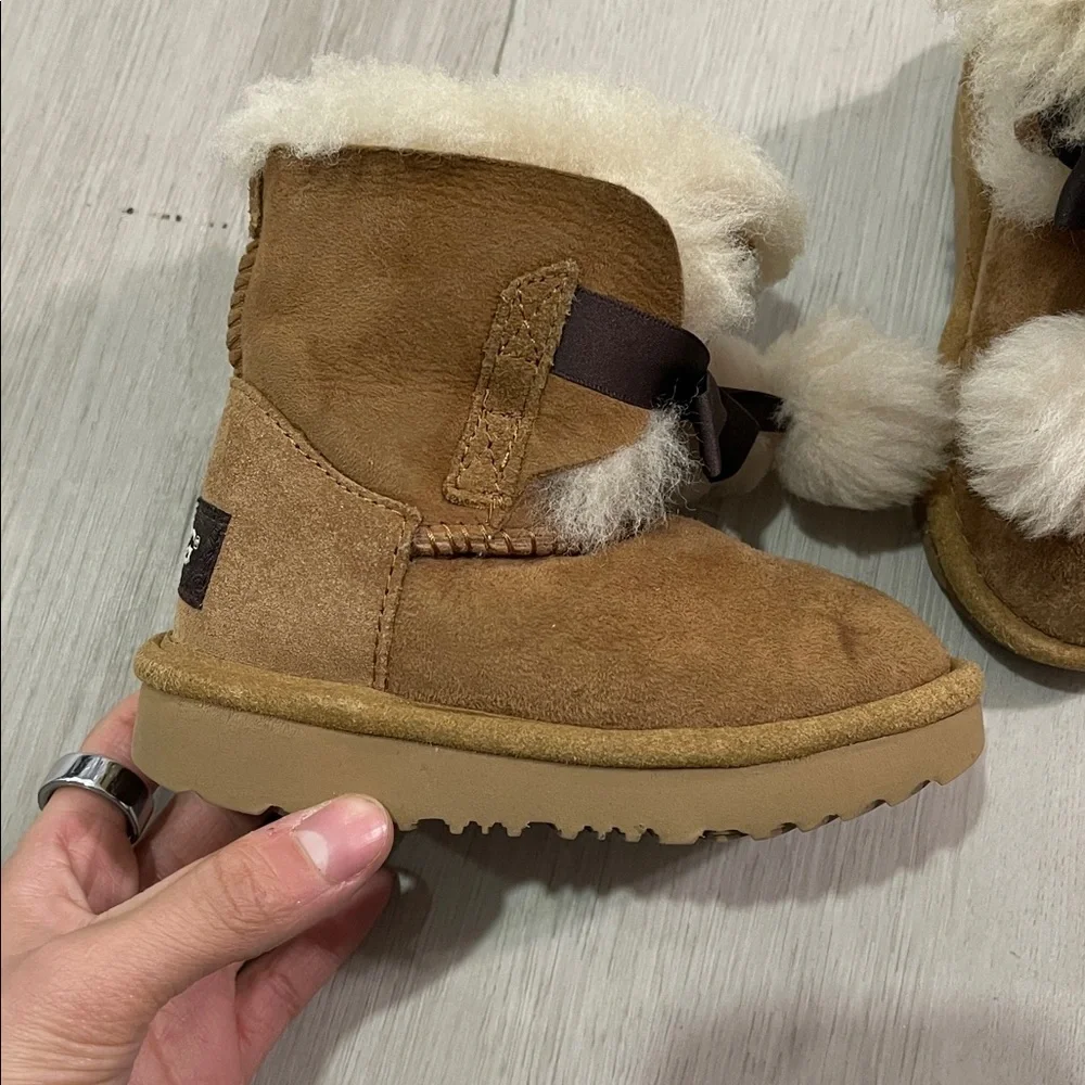 UGG Tan Shearling Boots with Pom Poms